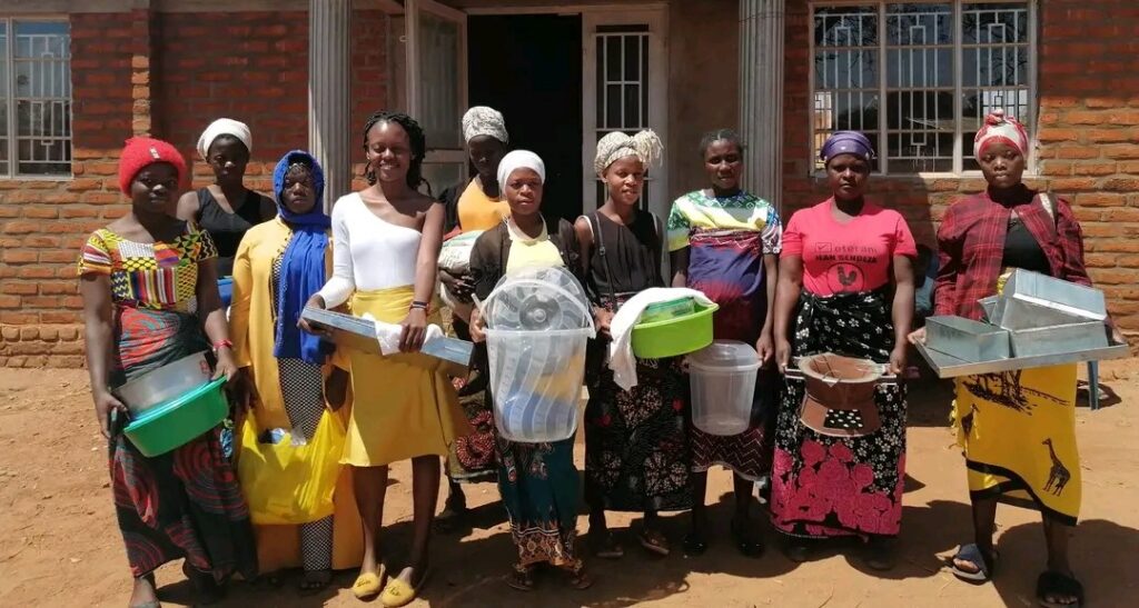 Lindsay Katchika Chazika, the founder of the Sprout Foundation, is pictured alongside women under Azimayi Opusha Program, aimed at enhancing lives through the initiation of small-scale businesses.